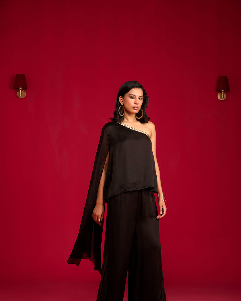 Black one-shoulder top and pant set.