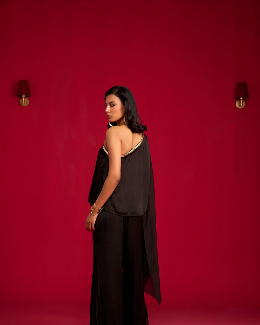 Black one-shoulder top and pant set.