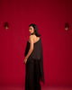 Black one-shoulder top and pant set.